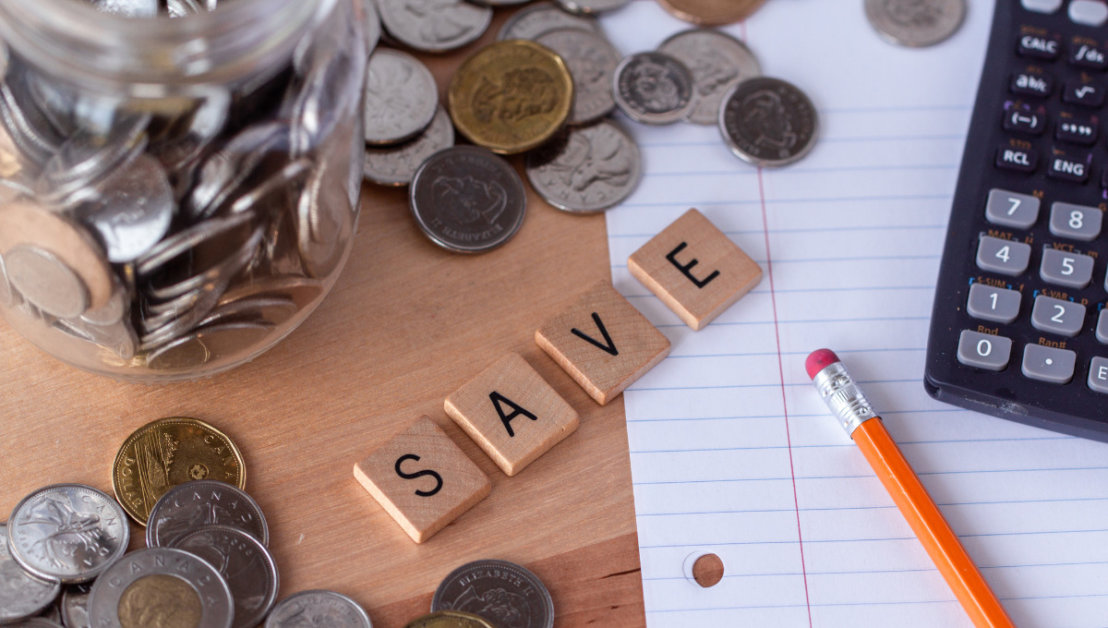 picture of wooden blocks spelling save on a desk